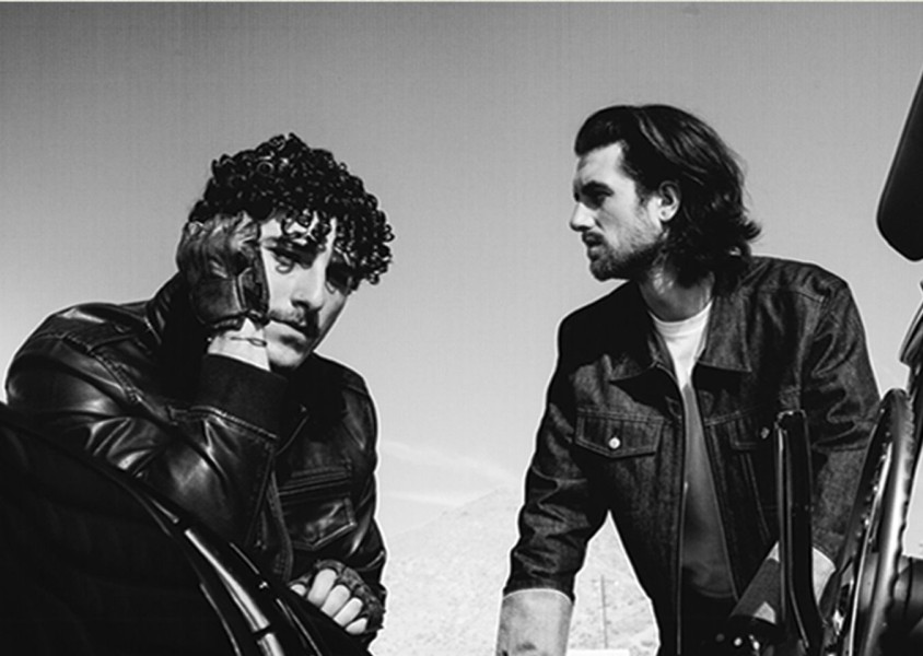 two men posing in black and whitex